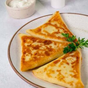 Benderyky (fried meat-filled crepes)